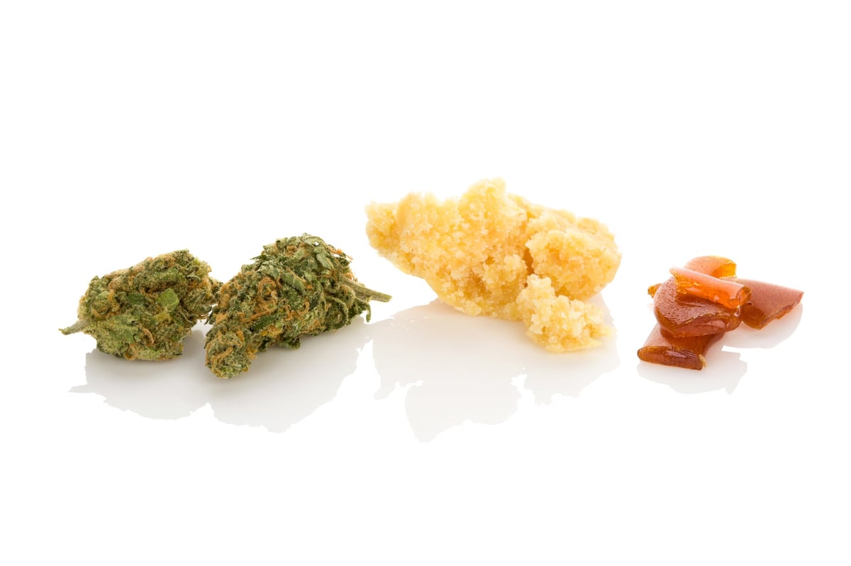 Cannabis bubble hash and concentrates arranged on a white background