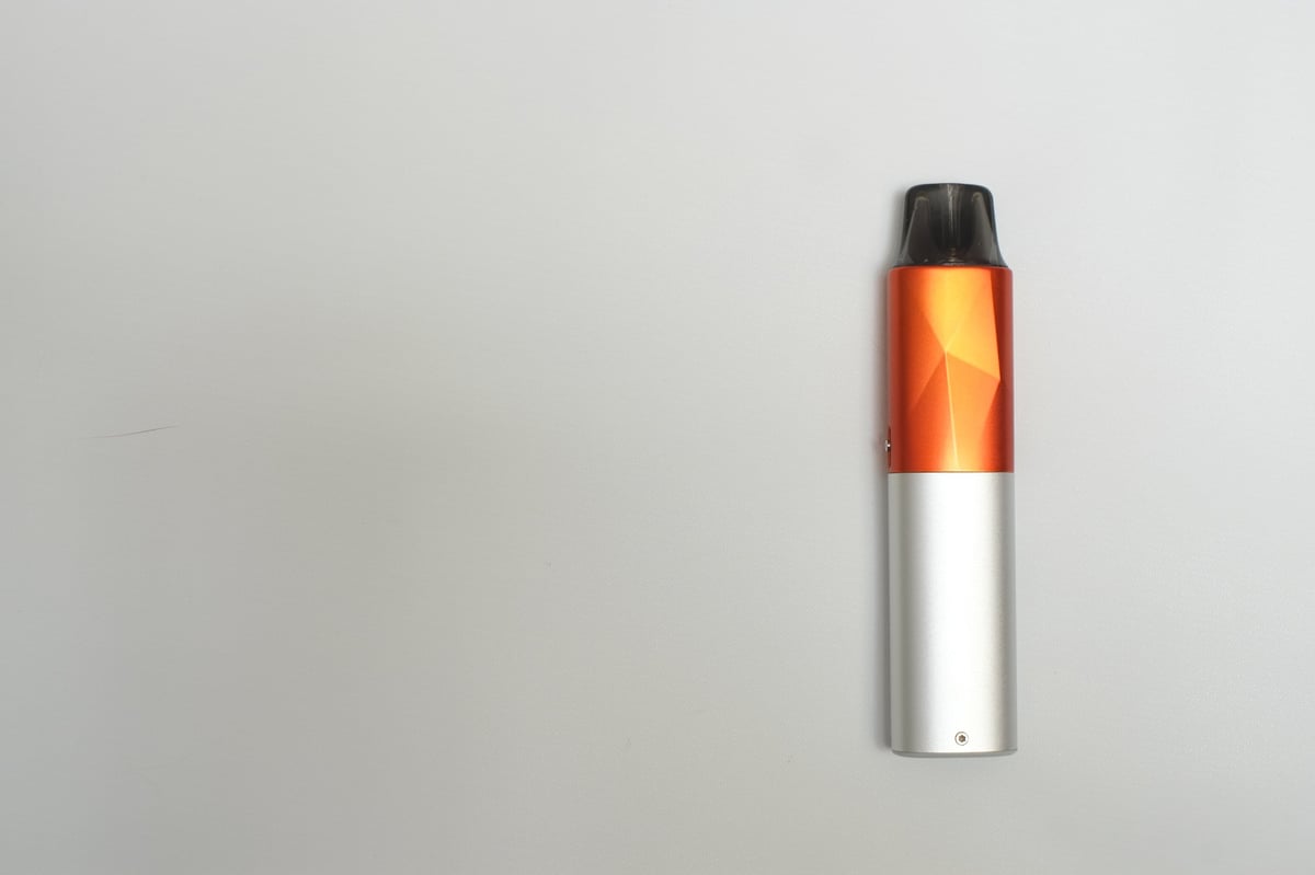 Modern disposable vape device isolated on a light background