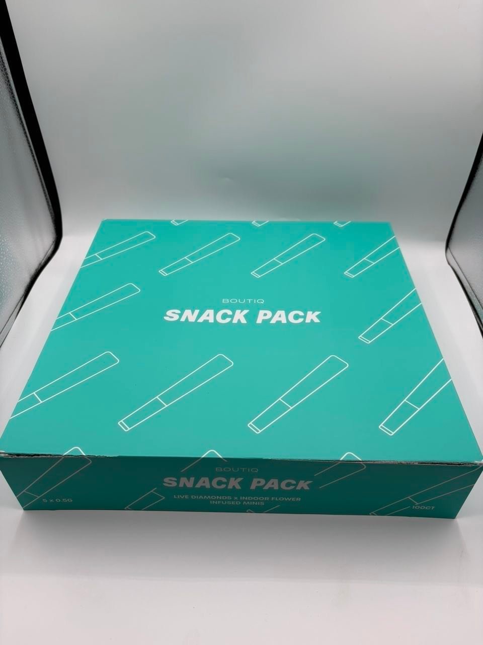 Snack pack box containing five mini infused cannabis pre-rolls