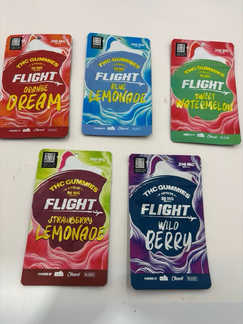 Five 300mg cannabis gummy pouches in assorted fruit flavours